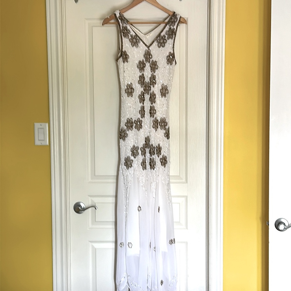 Long white sleeveless , v neck dress with sequins